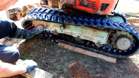 how to change tracks on a mini excavator|repair tracks in mini excavator.